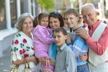 Family relaxing in summer city