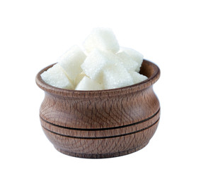 Cubes of sugar in wooden bowl , isolated on white background