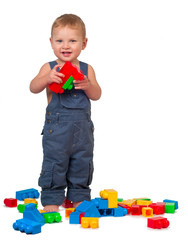 boy playing blocks isolated