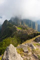 Fototapete Süd Amerika First sunlight on Machu Picchu from opening clouds  © fabio lamanna
