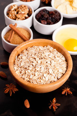 oat flakes and ingredients on a black table