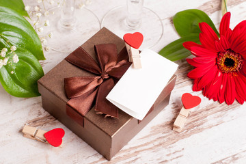 gift box, a note and hearts for Valentine's Day