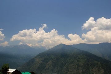 Blue sky with clouds background in mountains. Himalai, India