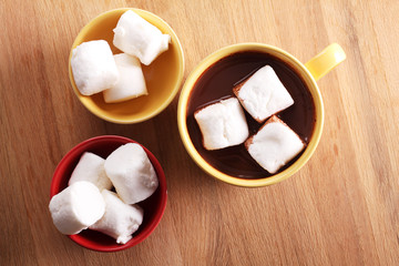 chocolate drink and marshmallows in colorful cups