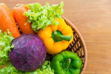 Healthy vegetable in basket put on wooden table