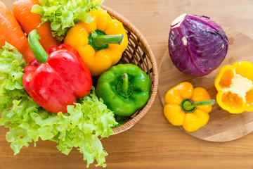 Healthy vegetable in basket put on wooden table