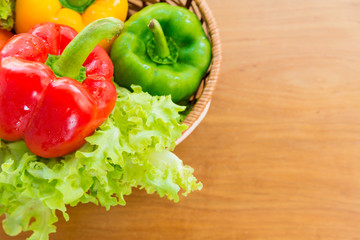 Healthy vegetable in basket put on wooden table