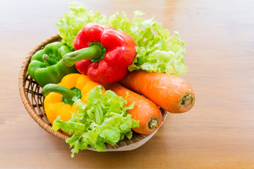 Healthy vegetable in basket put on wooden table