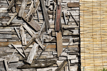 Reclaimed wood wall art and bamboo curtain