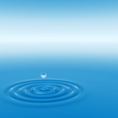 Conceptual blue liquid drop falling in water