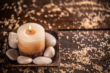 Candle and stones