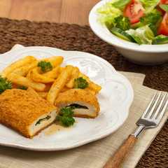 Chicken Kiev Cutlet. Boneless chicken breast with butter and herbs. Selective focus.