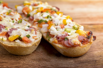 baked baguette with salami, cheese and vegetable