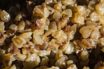 Friable stewed hot buckwheat cereal close up