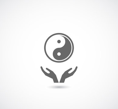 hands support ying yang symbol