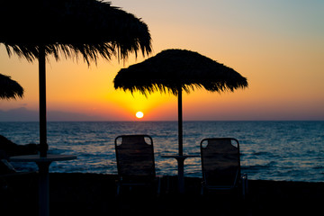 Sunset on the beach with parasol