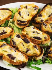 Bruschetta with olives and mozzarella