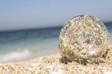 On The Beach II / A Coca-cola bottle filled with beach sand.