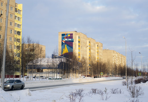 The nine-floor house pattern on the facade. City landscape.