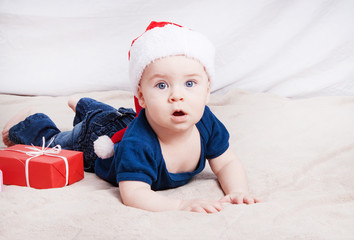 Beautiful little baby celebrates Christmas.