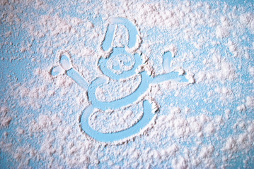 Snowman image of scattered flour on the table