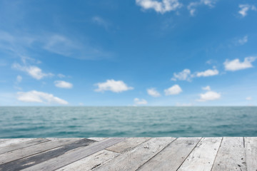 Wood, blue sea and sky background