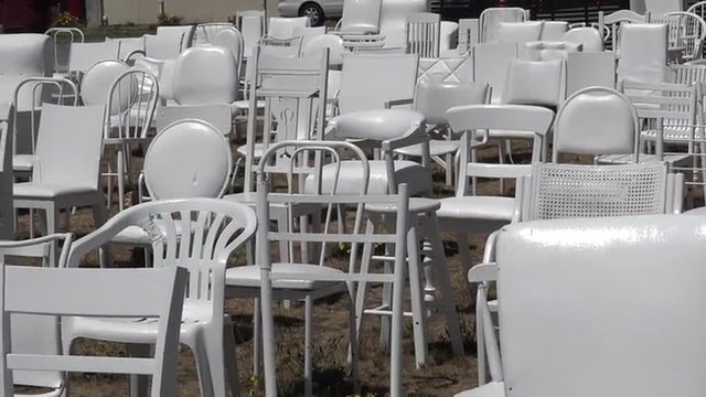 185 empty white chairs sculpture in Christchurch New Zealand