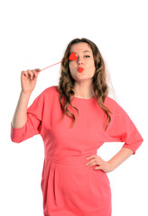 Beautiful woman closed her eye heart on a stick sends a kiss.Isolated on white background