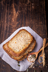 Slices of homemade dark fragrant fresh bread with poppy seeds, flax, sunflower and pumpkin