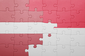 puzzle with the national flag of indonesia and latvia