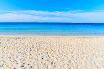 Fototapeta na wymiar White sand beach with crystal clear azure sea water in Grande Sperone bay, Corsica island, France