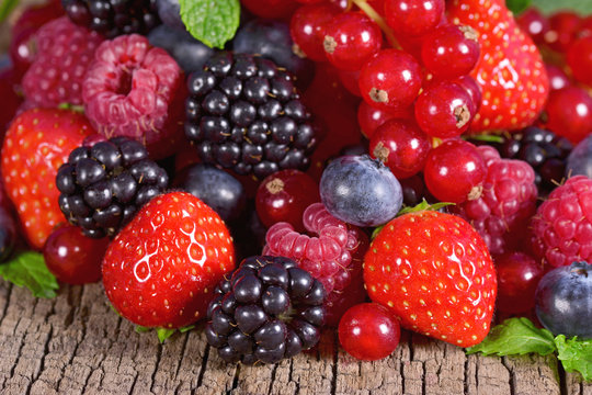 Fresh berries  on a wooden background
