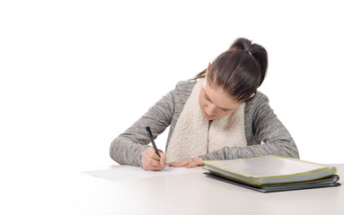  pretty young woman writing on her desk