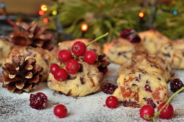red currants and homemade Christmas cookies with chocolate and dried berries