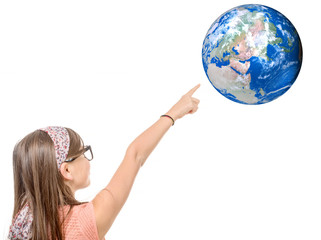 Portrait of a smiling little girl pointing finger on world globe