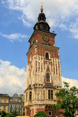 Fototapeta na wymiar City Hall tower against blue sky on main market square of Krakow