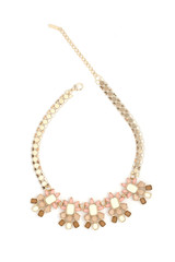Fototapeta premium gold necklace with pink stones isolated on white