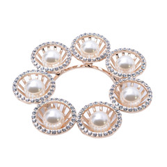 gold brooch with pearls isolated on white