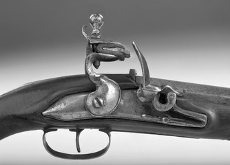 Antique French Flintlock Pistol in black and white.