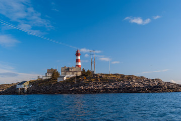 Norwegian lighthouse in summer sunny day