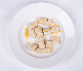 Lazy dumplings of cottage cheese with sour cream