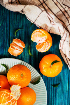 fruit, citrus , fresh, ripe and juicy tangerines on a wooden background