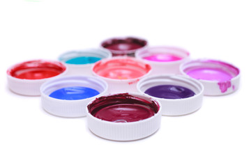 Colorful acrylic paints in covers