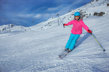 Girl skier in winter resort