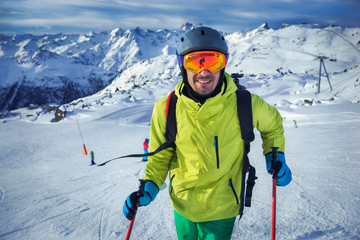 Skier man in winter mountains