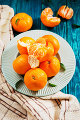 fruit, citrus , fresh, ripe and juicy tangerines on a wooden background
