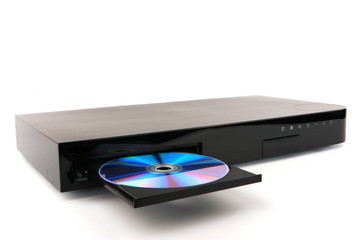 DVD, CD disk insert to dvd player on white background, close-up, isolated