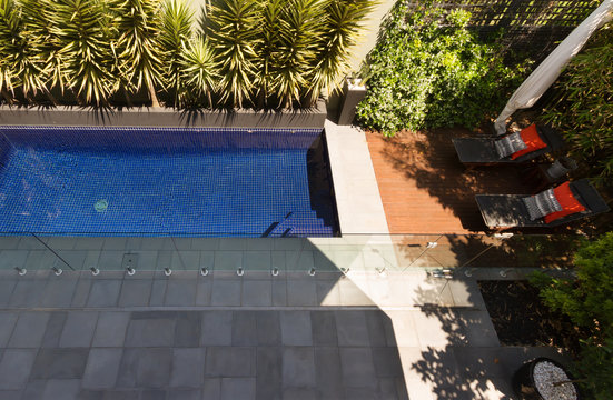 Overhead View Of A Backyard Swimming Pool In Contemporary Home