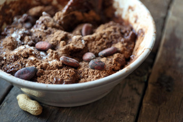 Preparing dough for chocolate pie on table close up