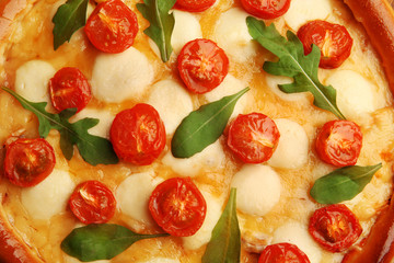 Pizza Margherita with arugula, close-up